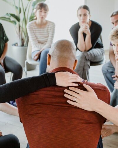 diverse-people-supporting-group-session